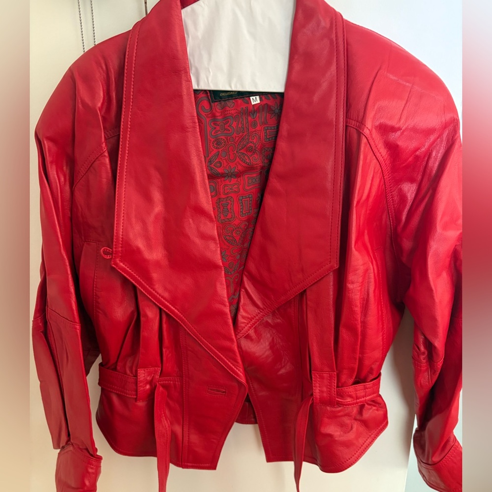 Bold Red Leather Jacket with Dramatic Lapels and Asymmetrical Design